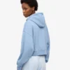 Sweat à capuche court zippé en coton bio - Bleu bord de mer